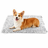 Perro corgi tumbado sobre la manta térmica autocalentable CozyPaws